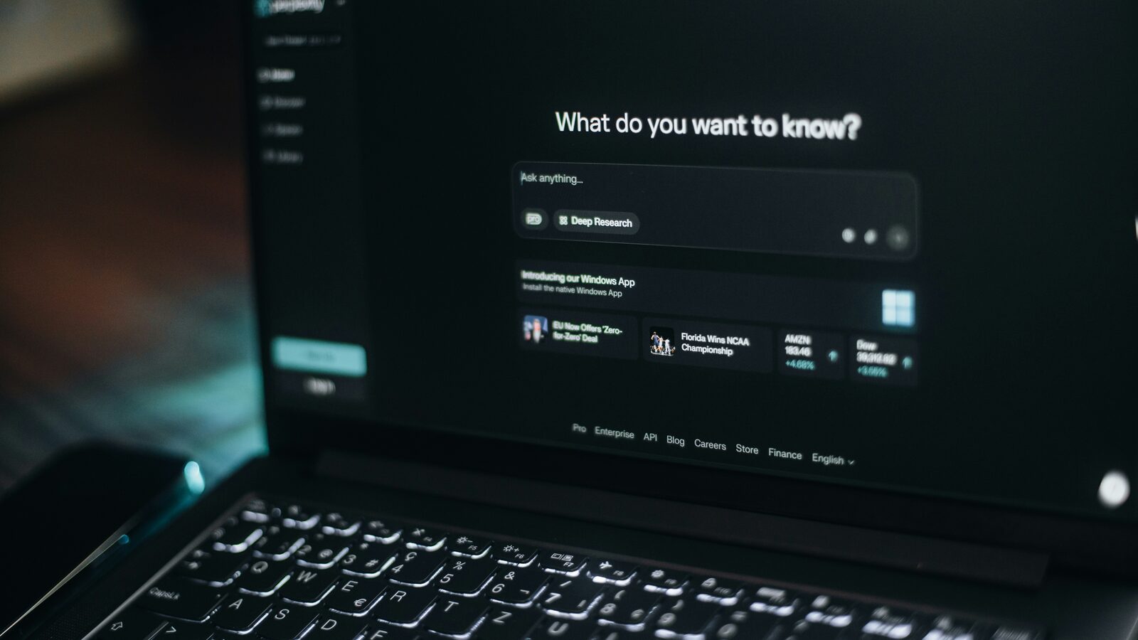 A laptop showing an AI assistant waiting for a question